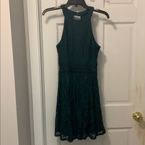 A green dress with cutouts.